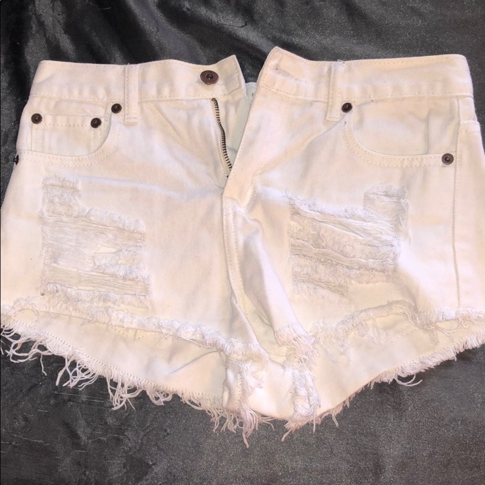 Distressed white shorts